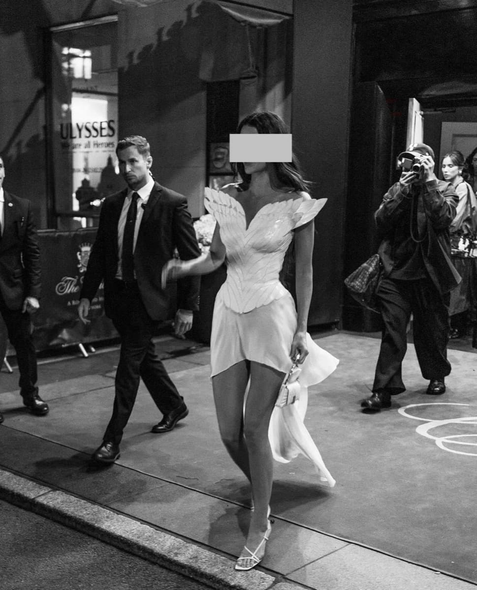 Executive protection agent walking with client