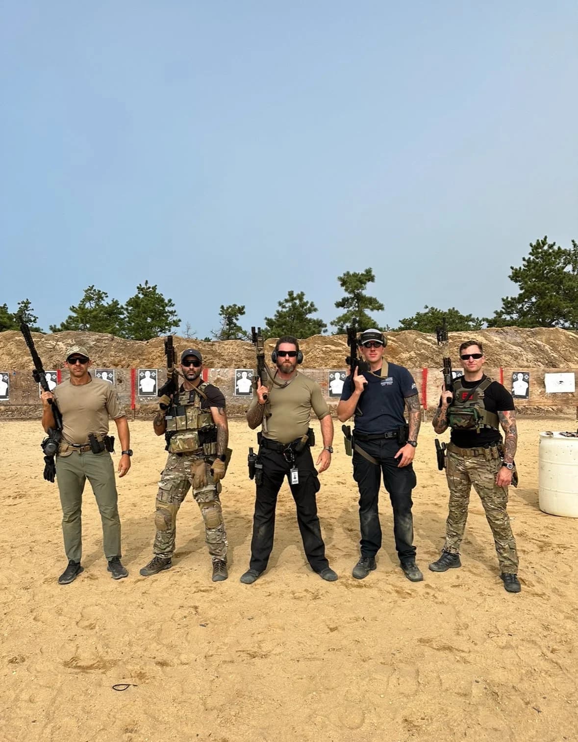 RS Black executive protection training team posed on the firing range